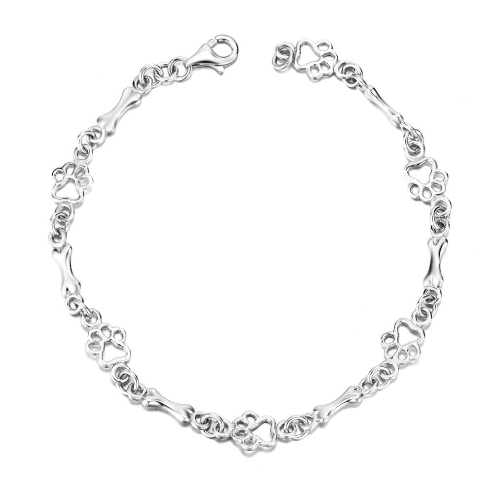 Pulsera con Dijes de Huella y Hueso en Plata